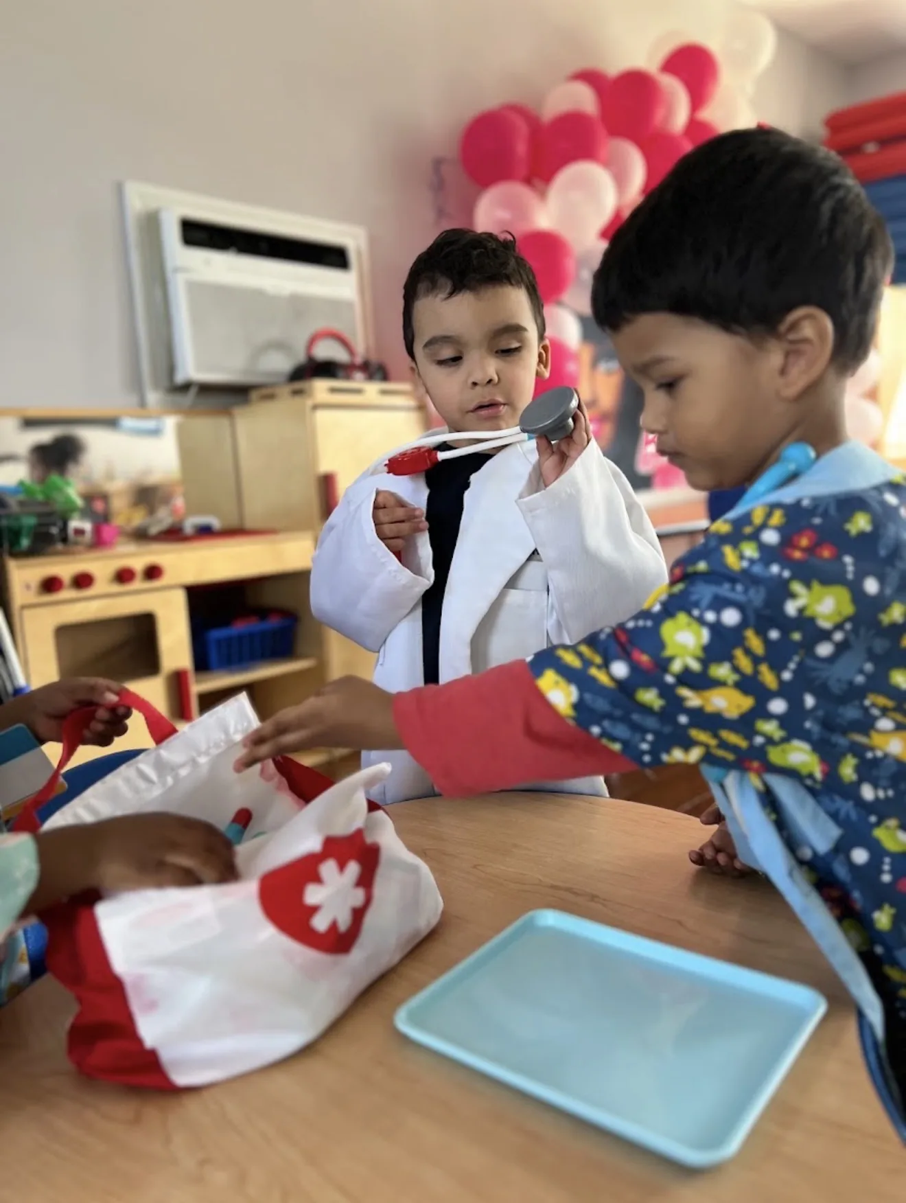 Children playing pretend doctor with dress-up costumes and toy instruments